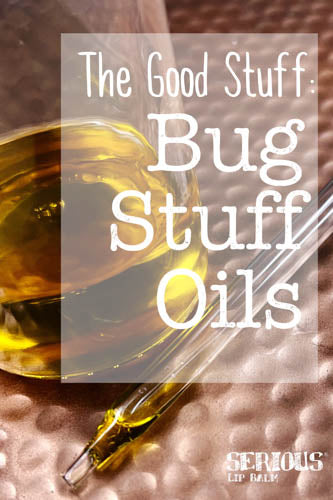 Small glass jar of essential oils sit on a copper plate with an eyedropper and the words "The Good Stuff: Bug Stuff Oils"